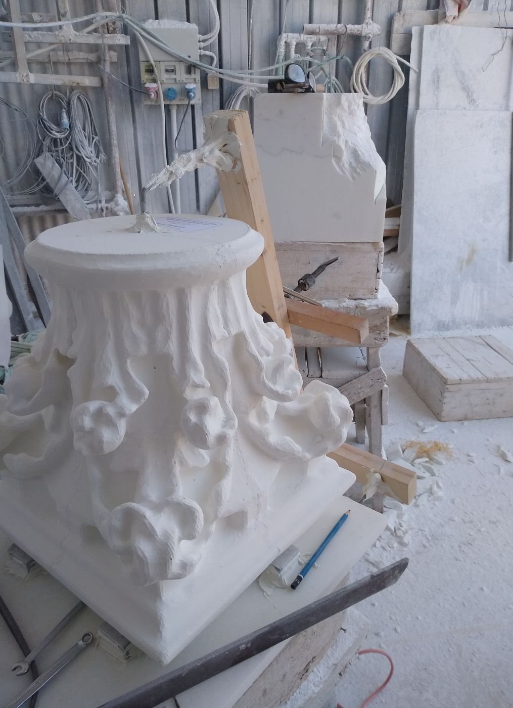 Corinthian marble capital, underside view, in progress at Studio Giannoni's Pietrasanta workshop