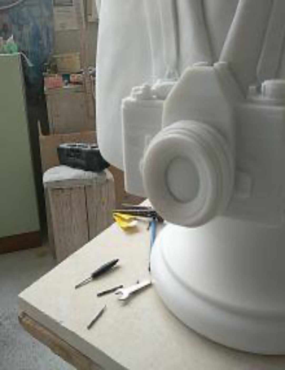 Close-up of the marble camera carved on a custom portrait bust, Studio Giannoni Pietrasanta
