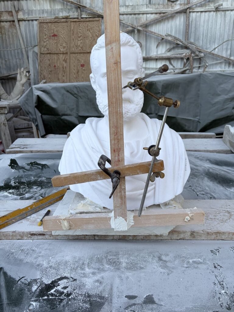 Pointing technique: the Vitruvius model inside a measuring frame with rods and callipers